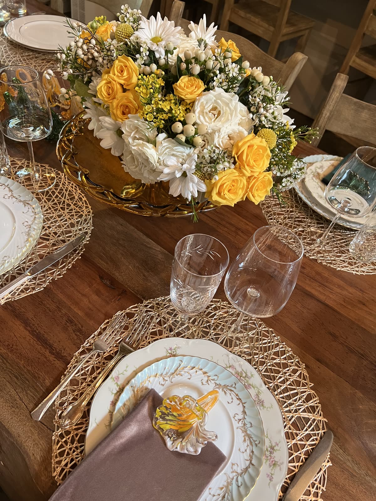 Overhead view of a place setting with floral arrangement